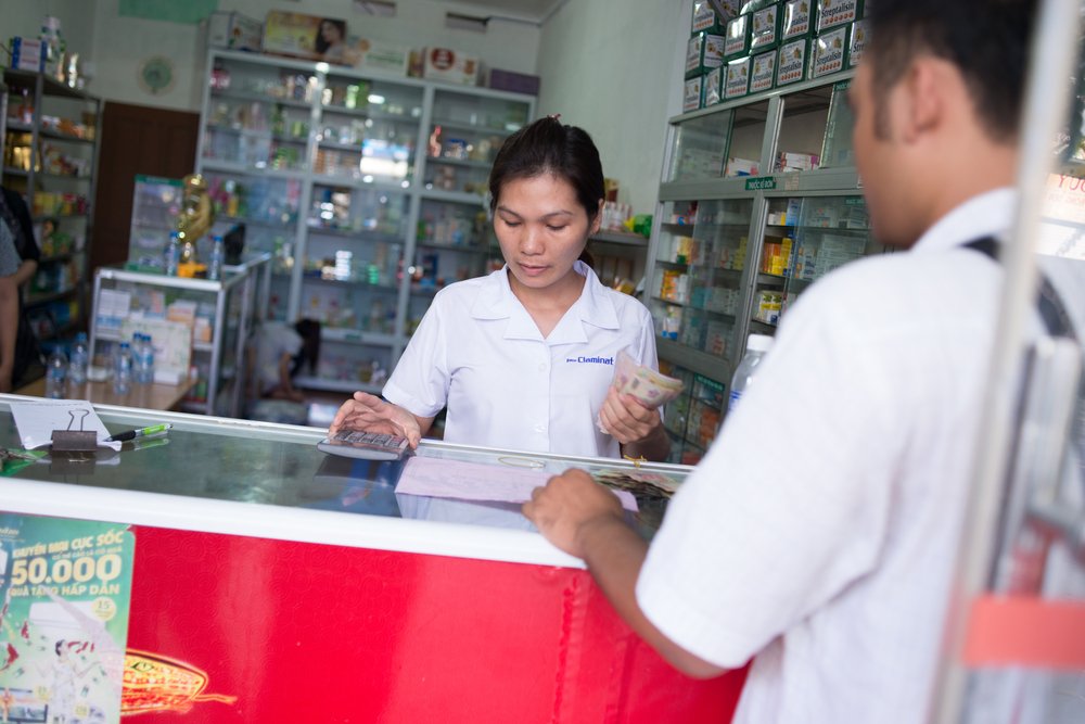 Pharmacist Hoang Thanh Nga assists a customer in Hanoi. Photo: PATH/Matthew Dakin.