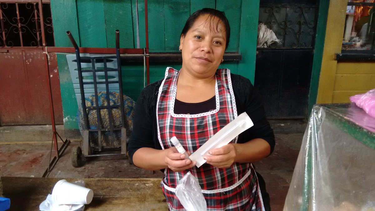 Women holding careHPV self-sampling brush